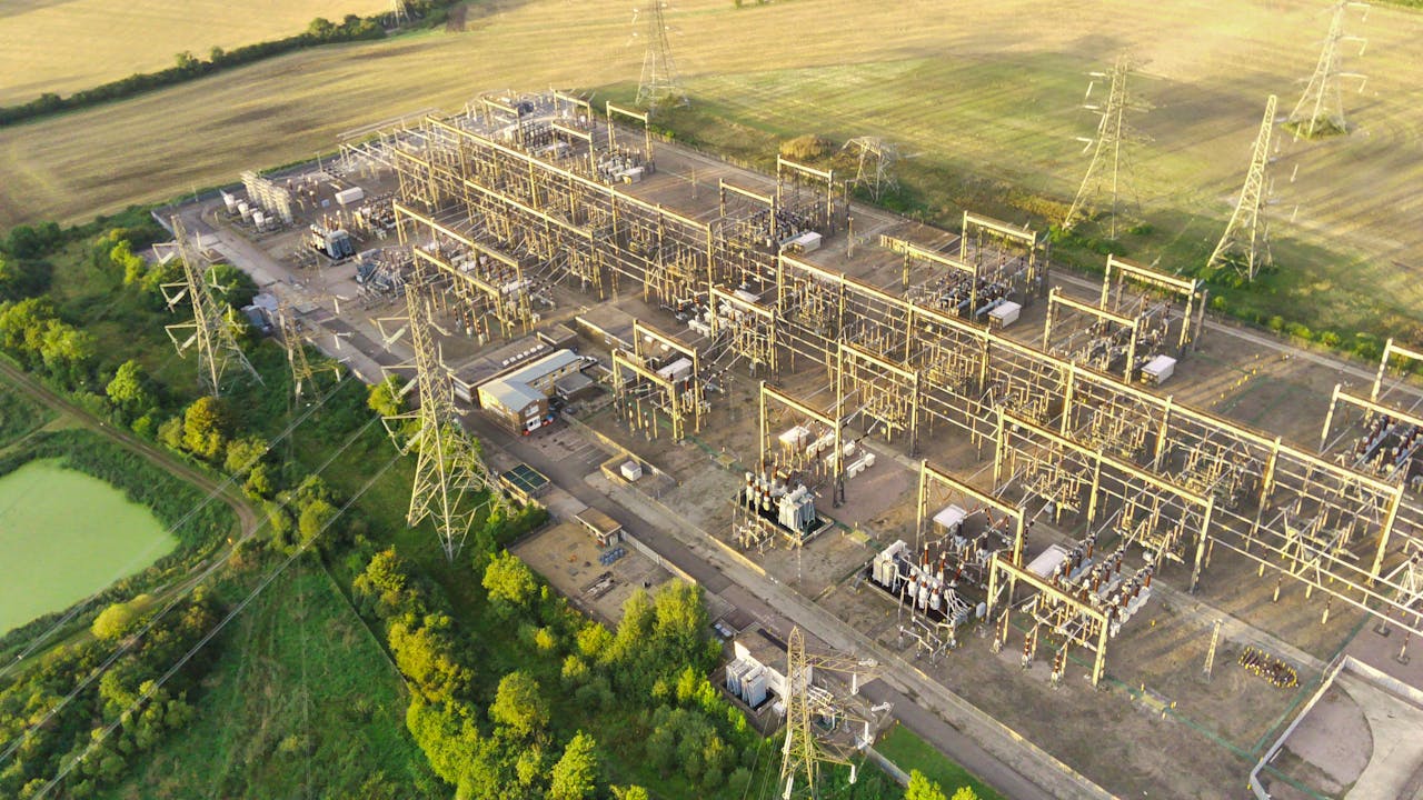 Mastering the First Impression: Your intriguing post title goes here Aerial shot of a power station surrounded by fields in rural England during daytime.