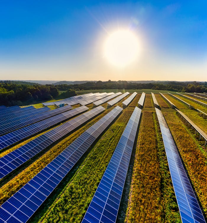 The Art of Drawing Readers In: Your attractive post title goes here Aerial view of a solar farm in Red Wing, MN, with solar panels harnessing the sun's energy.